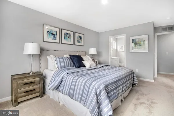 a bedroom with a bed and a closet