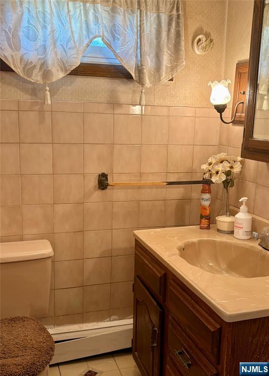 28 Arlington Avenue Paterson, NJ 07502 - Photo 12 of 25 a bathroom with a sink and a shower