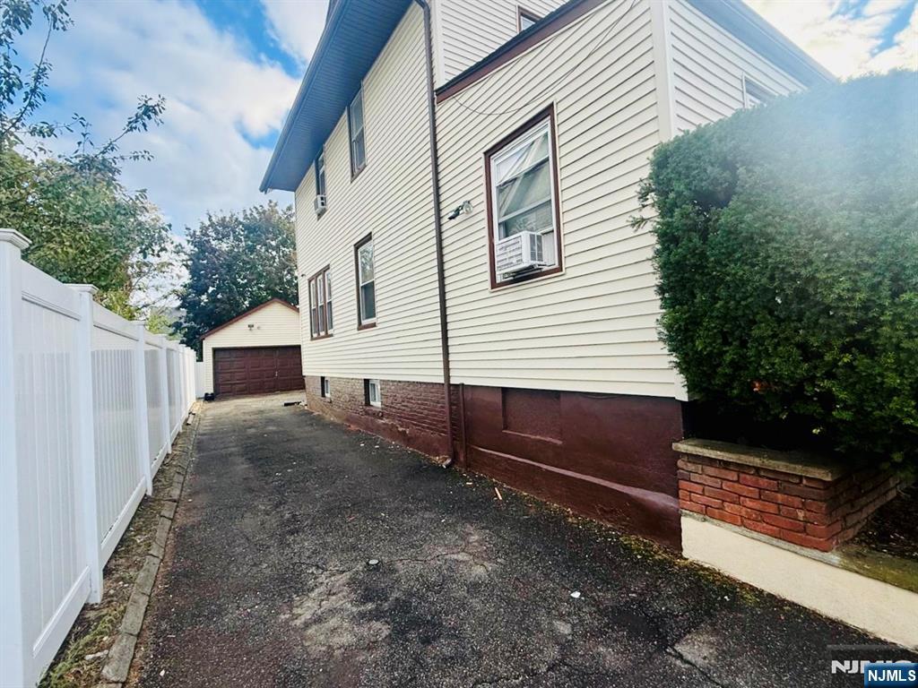 28 Arlington Avenue Paterson, NJ 07502 - Photo 2 of 25 a view of a house with backyard and trees