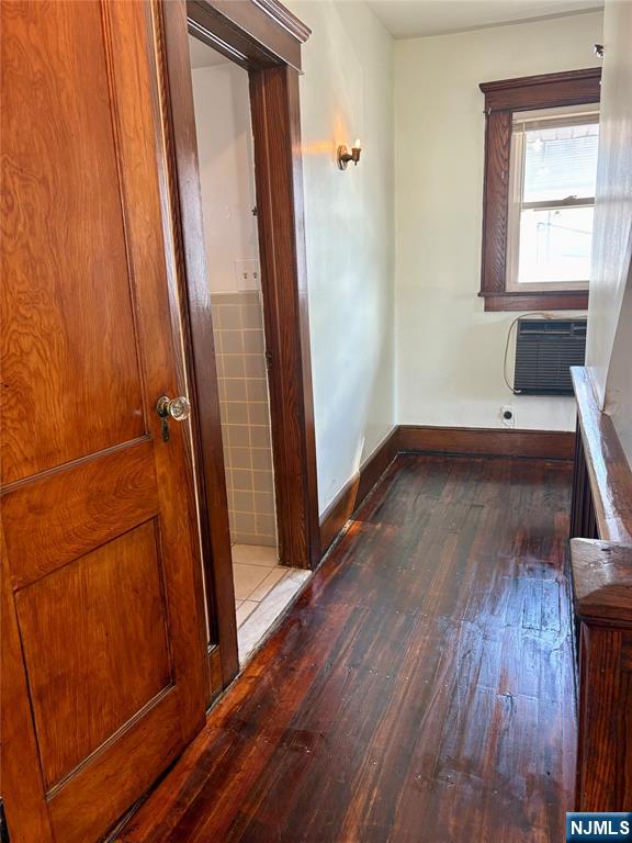 28 Arlington Avenue Paterson, NJ 07502 - Photo 21 of 25 an empty room with wooden floor and entrance