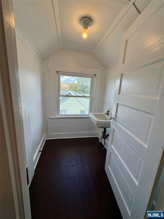 28 Arlington Avenue Paterson, NJ 07502 - Photo 24 of 25 wooden floor in an empty room with a window