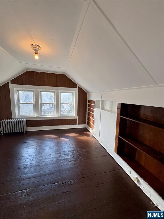 28 Arlington Avenue Paterson, NJ 07502 - Photo 25 of 25 an empty room with wooden floor and windows