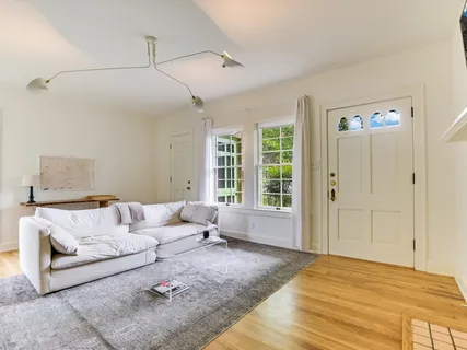a living room with furniture and a window
