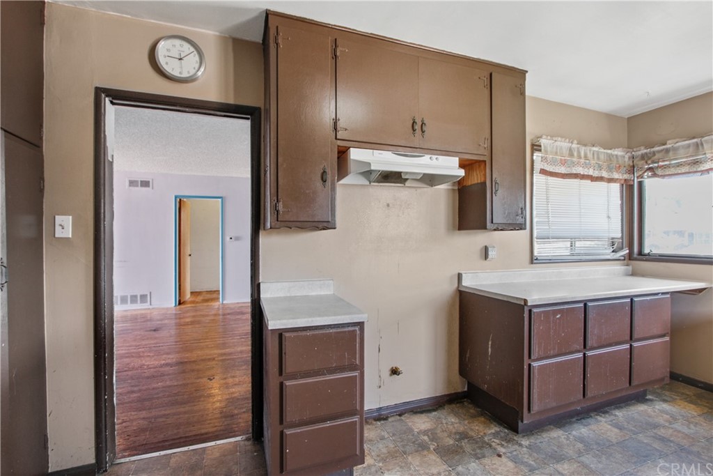 8849 Pico Vista Road Pico Rivera, CA 90660 - Photo 12 of 35 a kitchen with a stove and a refrigerator