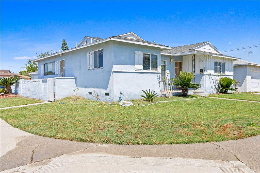 8849 Pico Vista Road Pico Rivera, CA 90660 - Photo 2 of 35 a view of a house with a yard