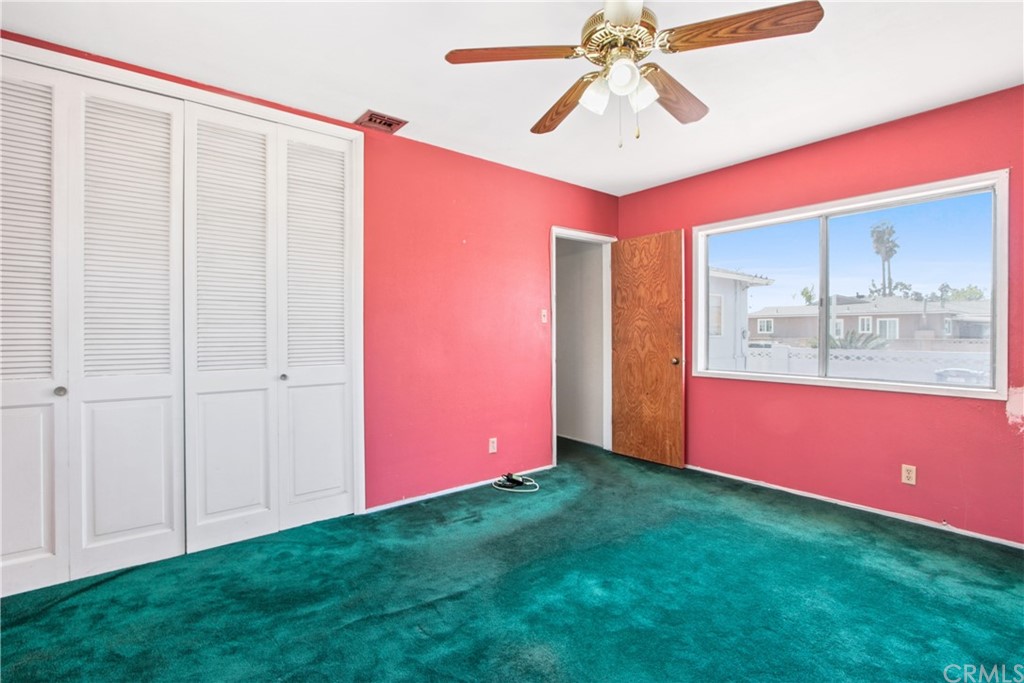 8849 Pico Vista Road Pico Rivera, CA 90660 - Photo 21 of 35 a view of an empty room with chandelier fan and fire place