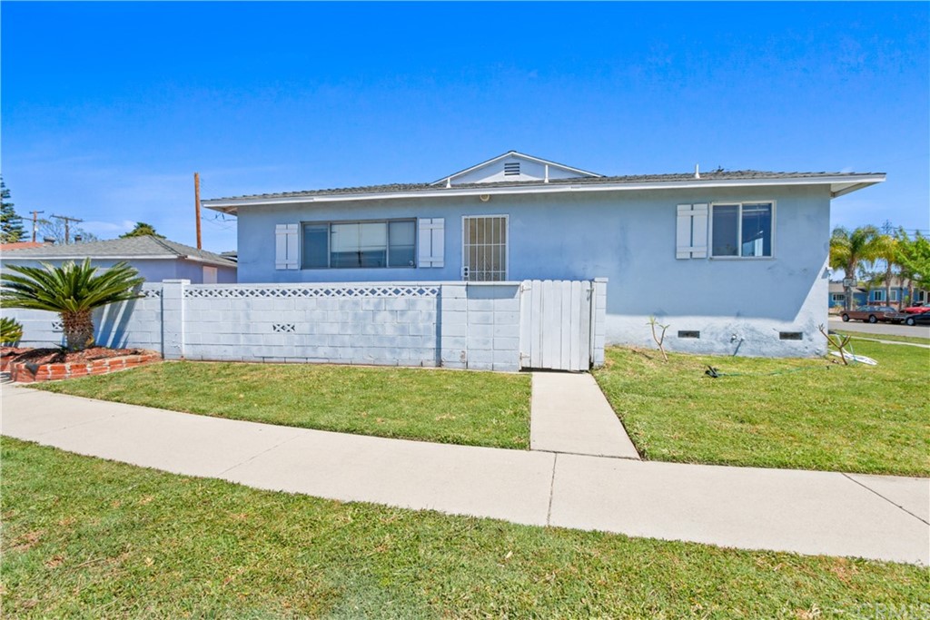 8849 Pico Vista Road Pico Rivera, CA 90660 - Photo 3 of 35 a front view of a house with a yard