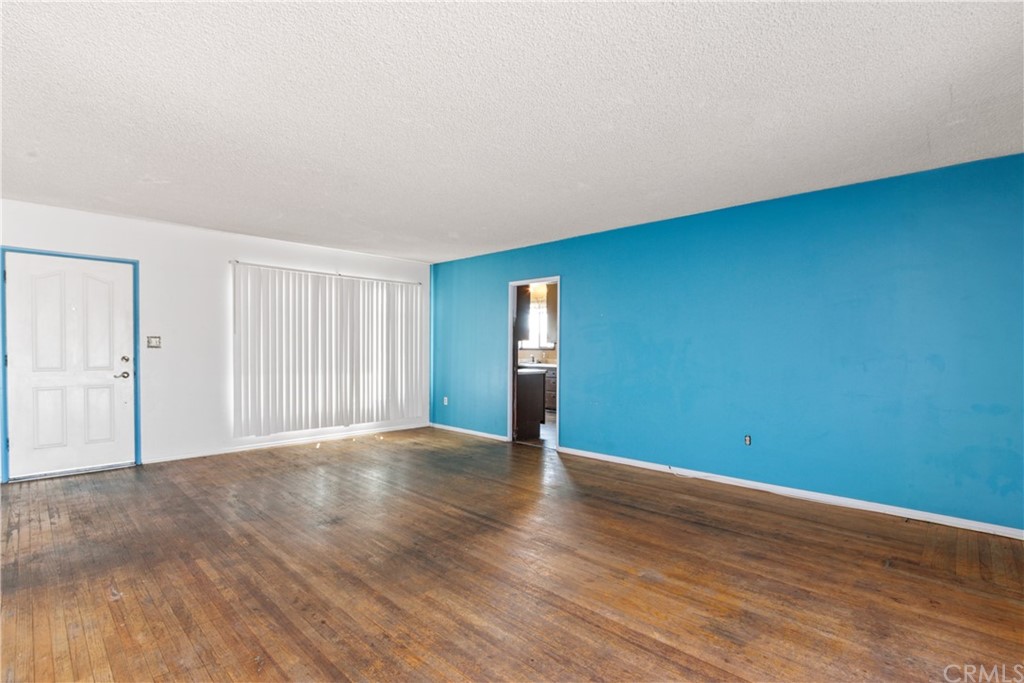 8849 Pico Vista Road Pico Rivera, CA 90660 - Photo 8 of 35 a view of an empty room with wooden floor