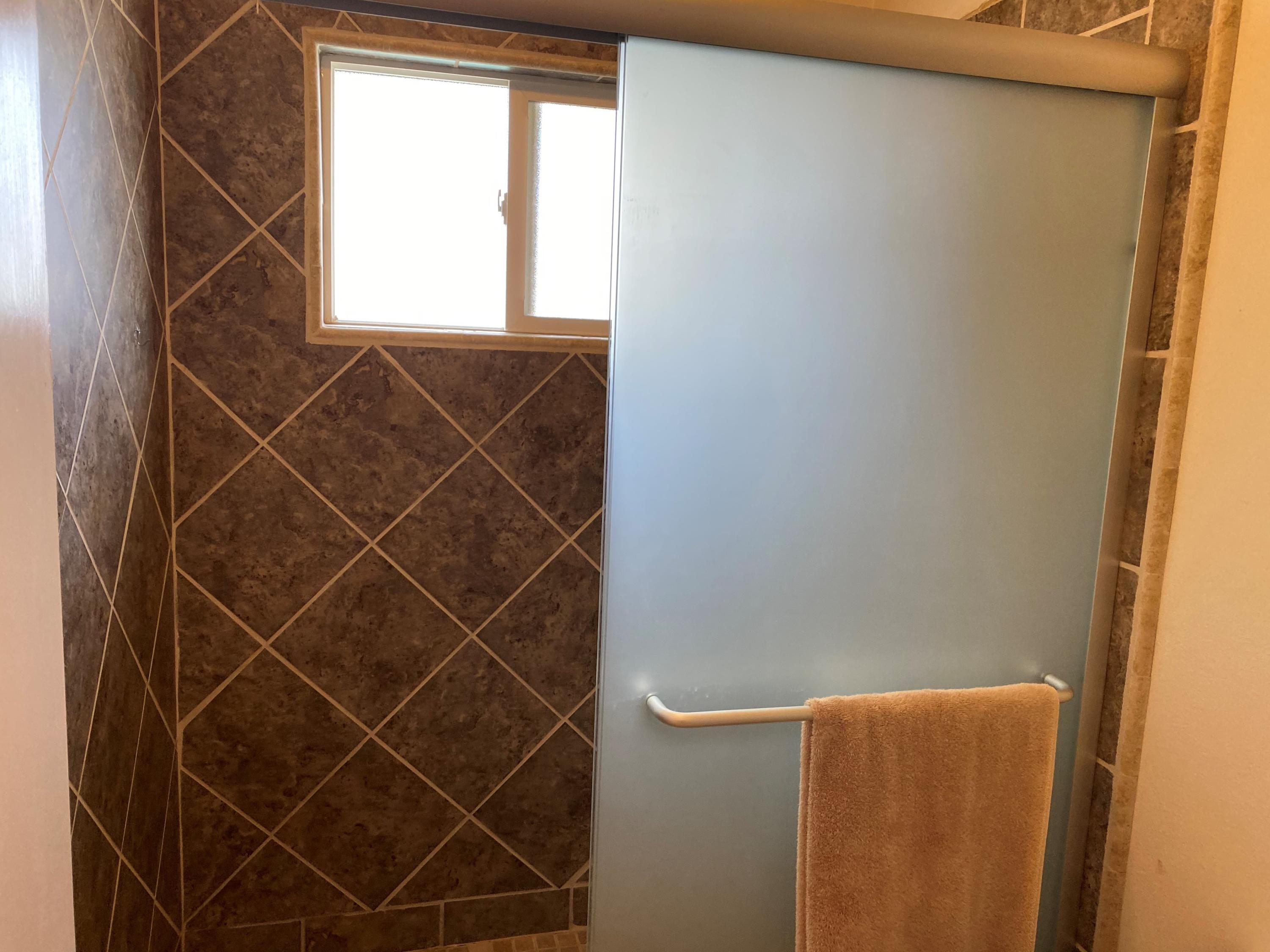 351 South Cornucopia Road Exeter, CA 93221 - Photo 9 of 22 a room with a window and a shower