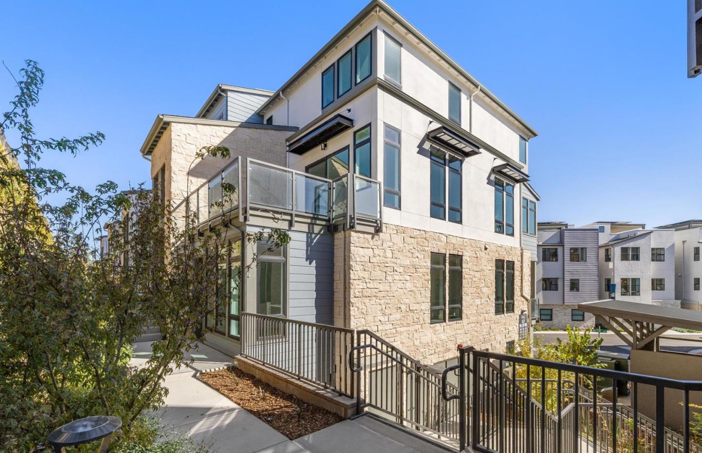 a front view of a house with large windows