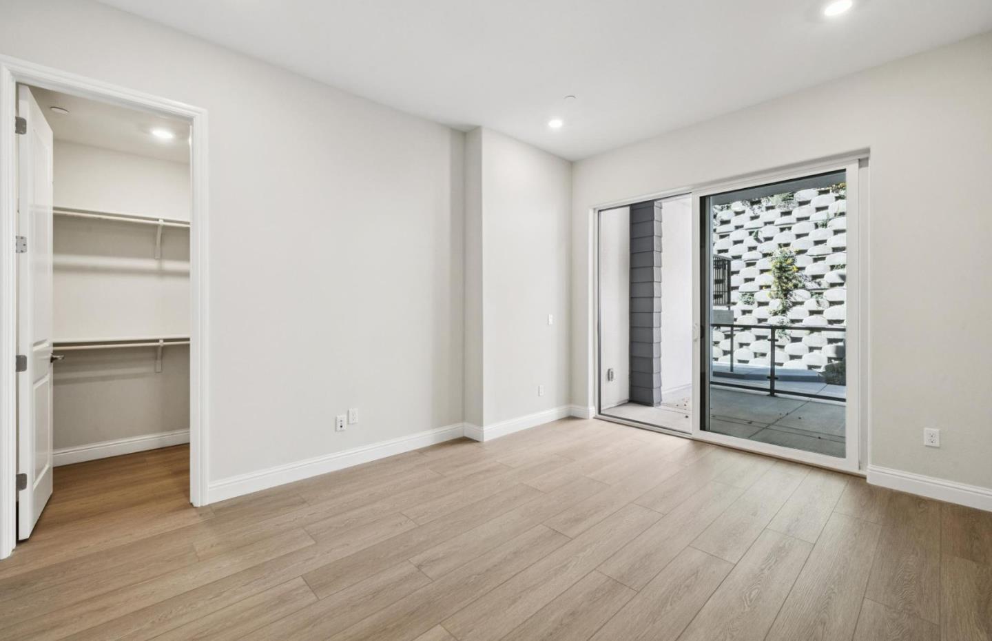 2425 Willow Way San Mateo, CA 94403 - Photo 15 of 39 an empty room with wooden floor closet and windows