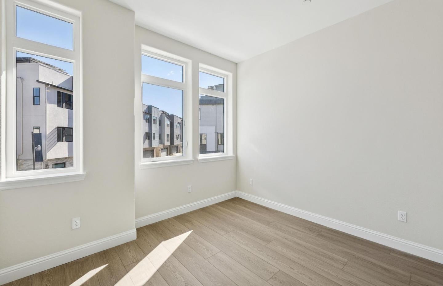 2425 Willow Way San Mateo, CA 94403 - Photo 24 of 39 a view of an empty room with wooden floor and a window