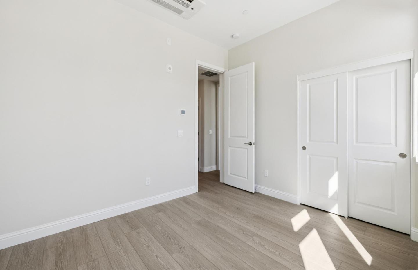 2425 Willow Way San Mateo, CA 94403 - Photo 25 of 39 a view of an empty room with wooden floor