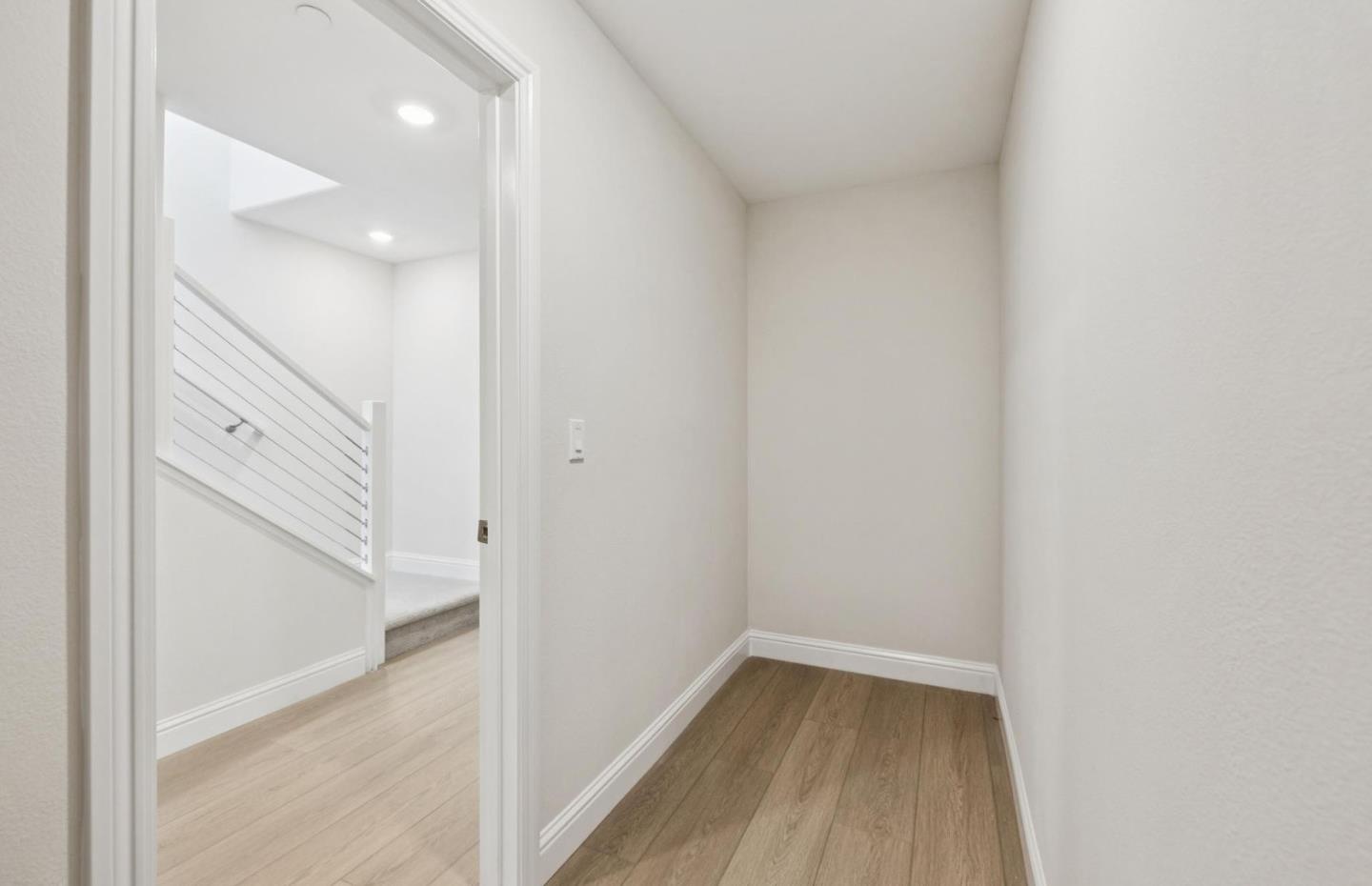 2425 Willow Way San Mateo, CA 94403 - Photo 31 of 39 a view of a hallway with wooden floor