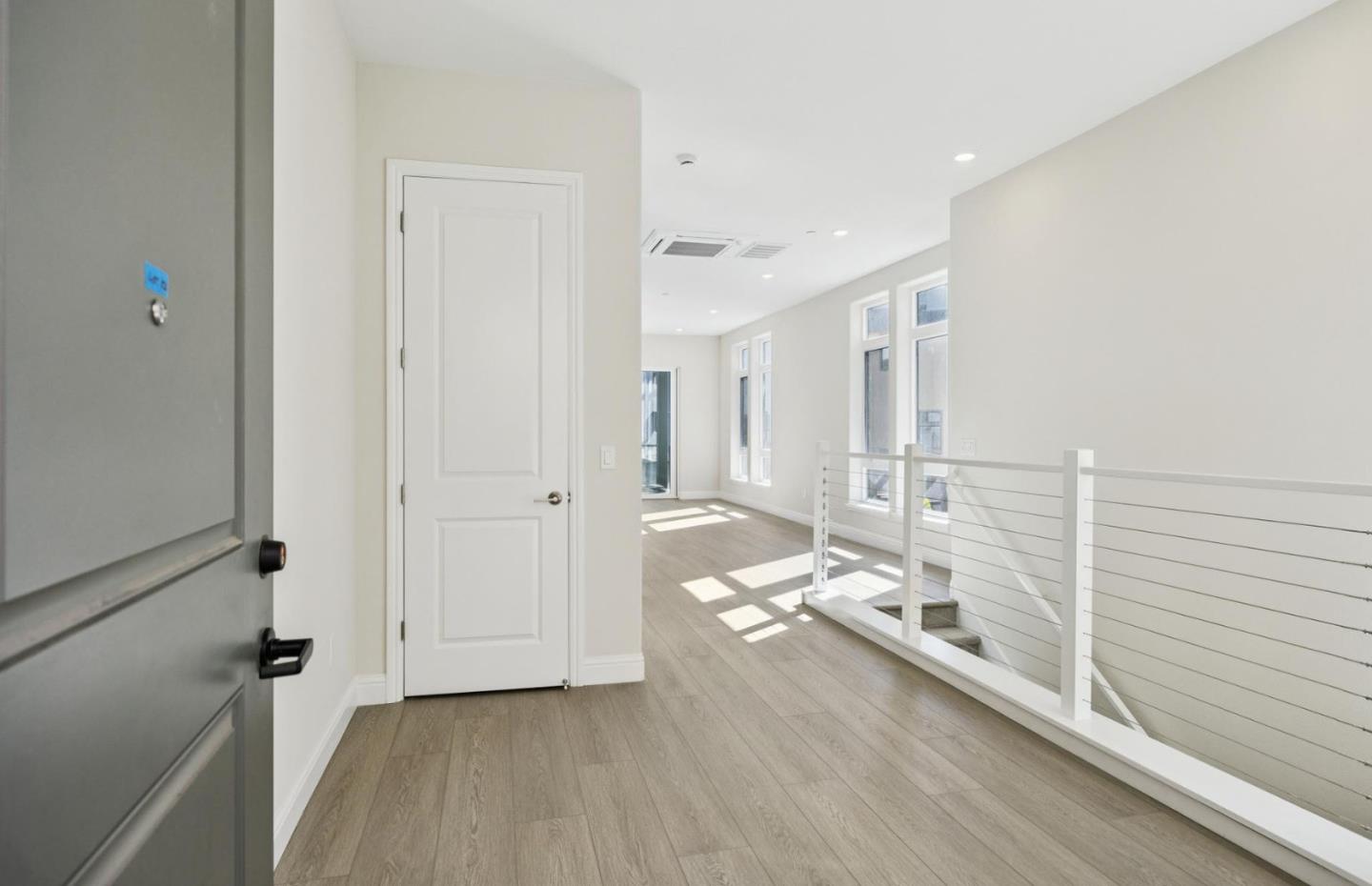 2425 Willow Way San Mateo, CA 94403 - Photo 33 of 39 a living room with hard wood floors and white walls