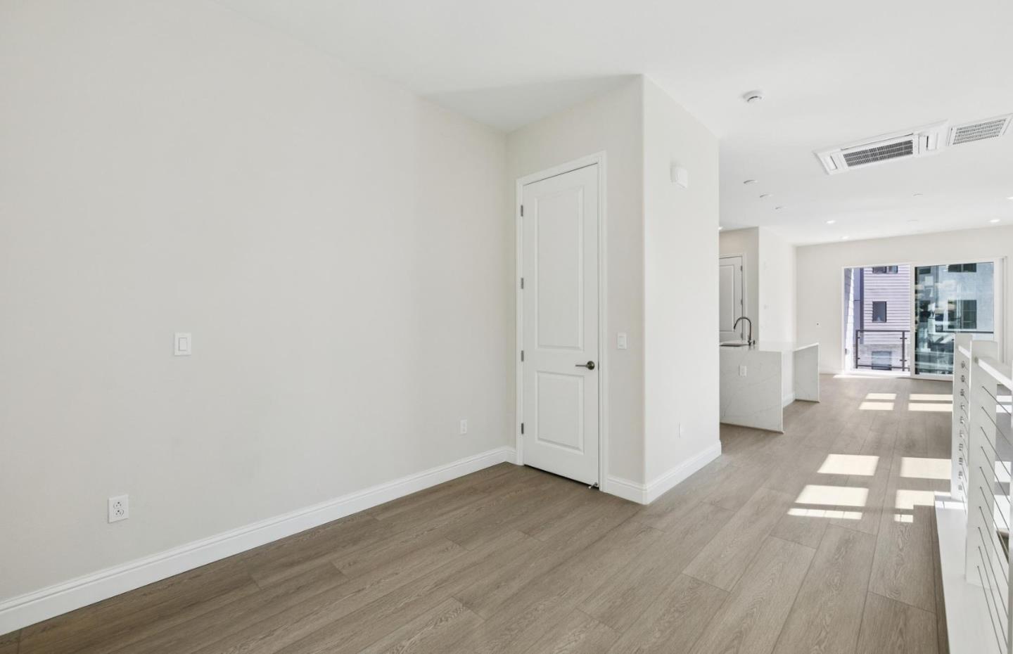 2425 Willow Way San Mateo, CA 94403 - Photo 35 of 39 a view of a hallway with wooden floor and a bathroom