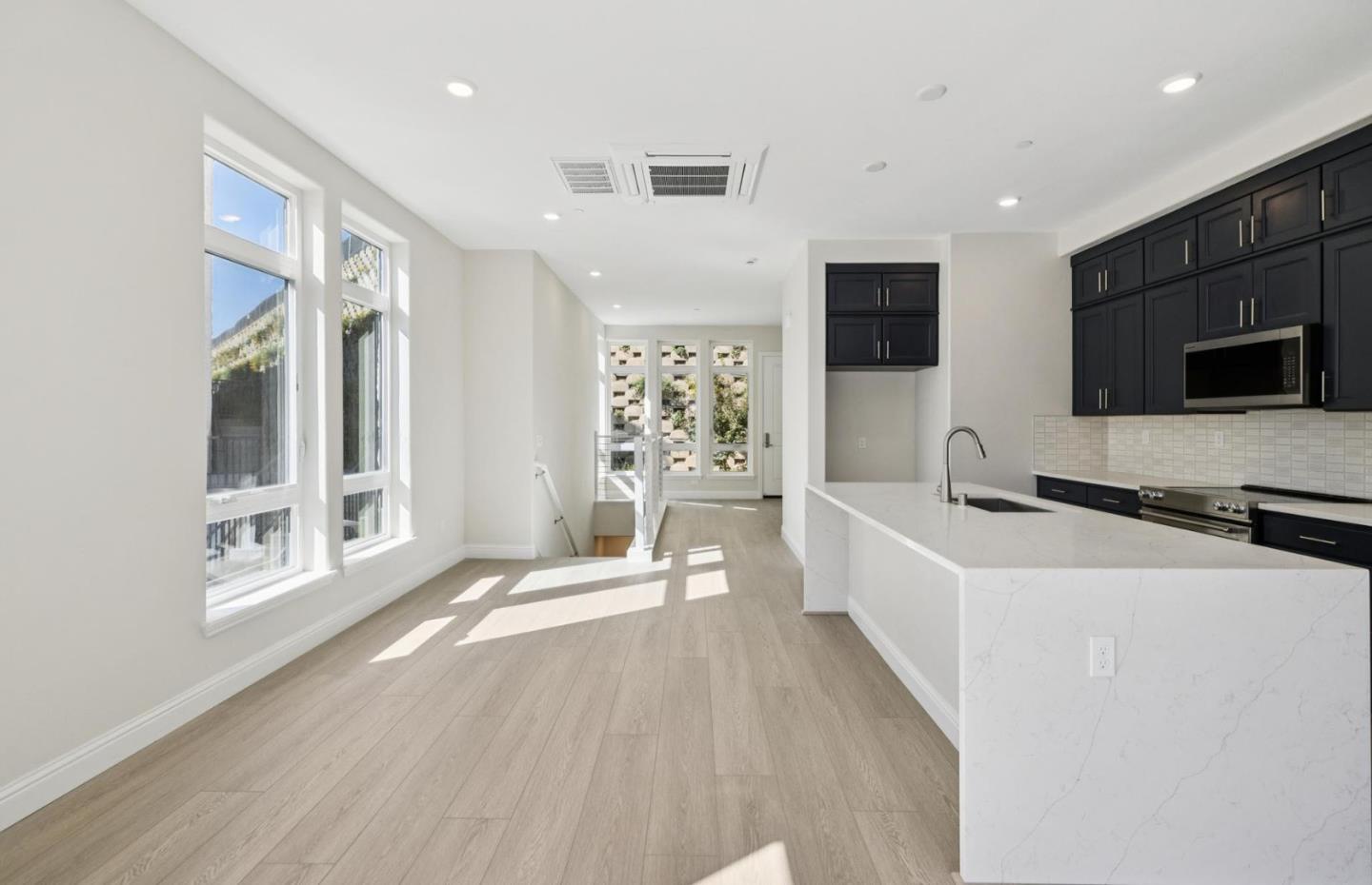 2425 Willow Way San Mateo, CA 94403 - Photo 38 of 39 a living room with stainless steel appliances furniture and a flat screen tv