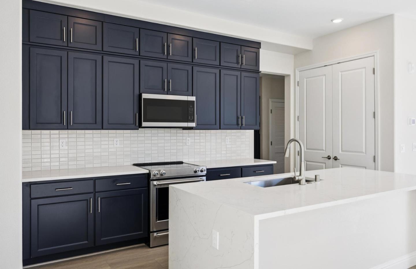 2425 Willow Way San Mateo, CA 94403 - Photo 5 of 39 a kitchen with a sink and cabinets