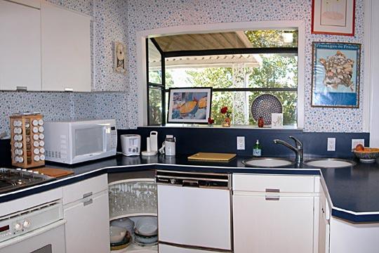 711 Moreno Road Santa Barbara, CA 93103 - Photo 7 of 18 a kitchen with a sink and a stove top oven
