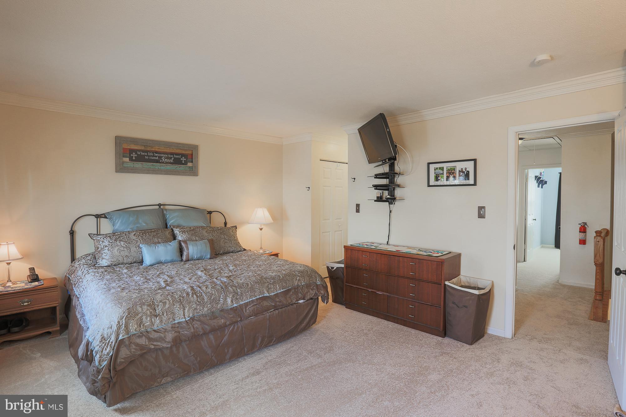 3904 Hunt Harbor Road Baltimore, MD 21220 - Photo 14 of 27 a bedroom with a bed and a couch