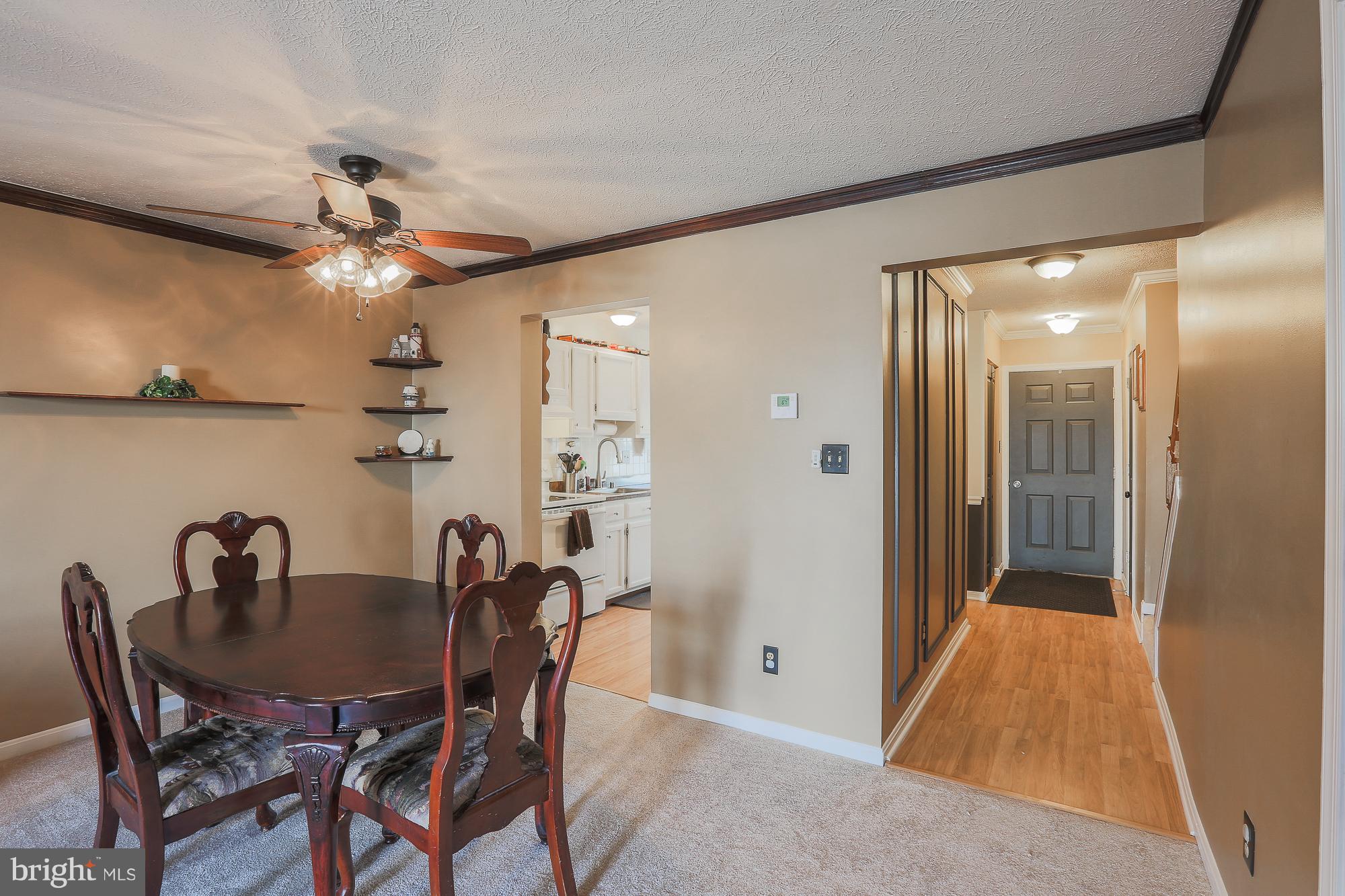 3904 Hunt Harbor Road Baltimore, MD 21220 - Photo 3 of 27 a view of a dining room with furniture and a chandelier fan