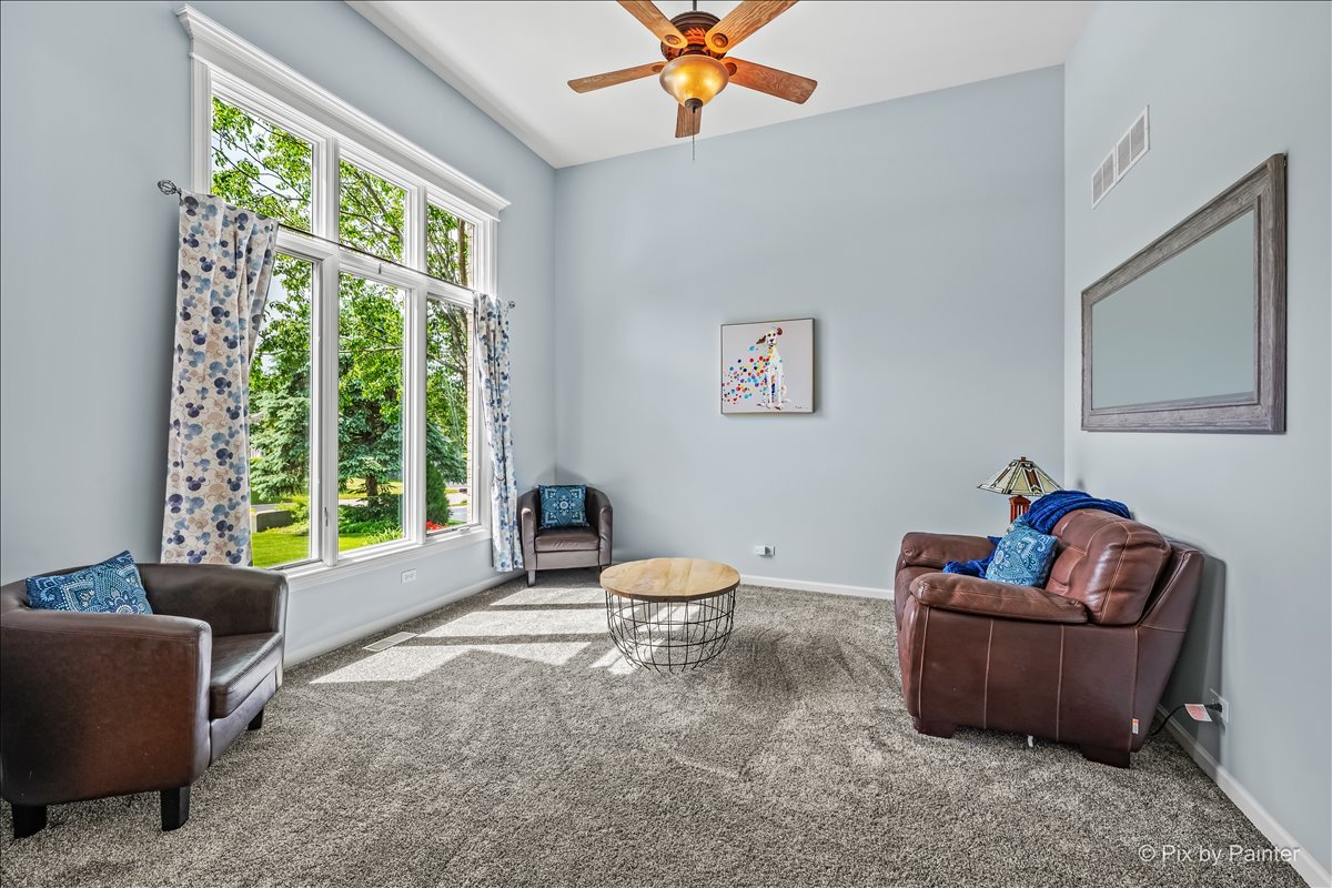 7104 Dove Way Cary, IL 60013 - Photo 8 of 82 a living room with furniture and a large window