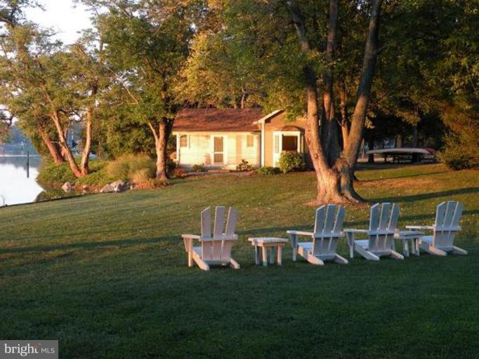 6857 Edge Creek Road St. Michaels, MD 21663 - Photo 12 of 13 a view of a table and chairs in the garden