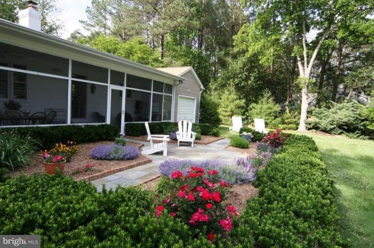 6857 Edge Creek Road St. Michaels, MD 21663 - Photo 3 of 13 a view of a house with sitting area and garden
