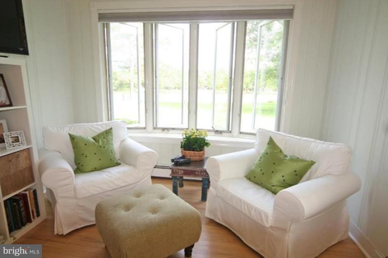 6857 Edge Creek Road St. Michaels, MD 21663 - Photo 7 of 13 a living room with furniture and a large window
