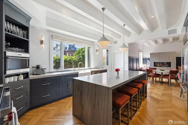a living room with a fireplace and a table