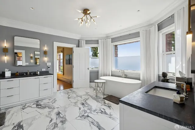 a living room with furniture a rug and a large window
