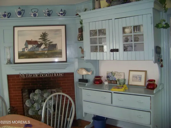 a kitchen with cabinets appliances a sink and a window
