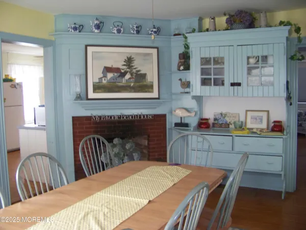a view of a dining room with furniture and window