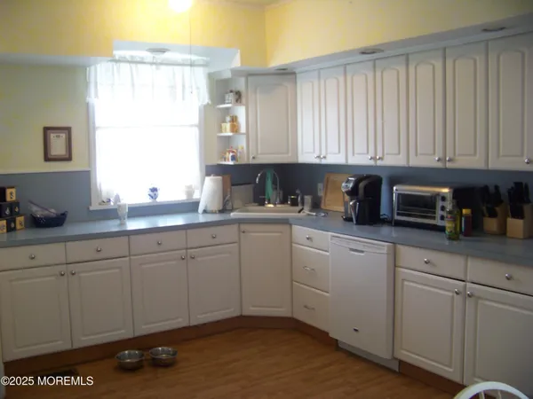 a bedroom with a bed and a night stand