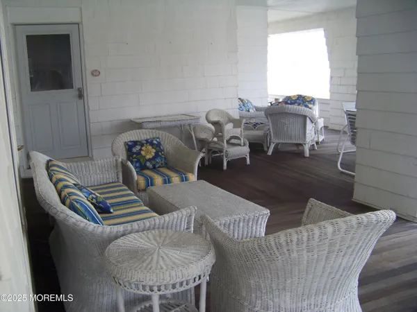 a view of a balcony with furniture