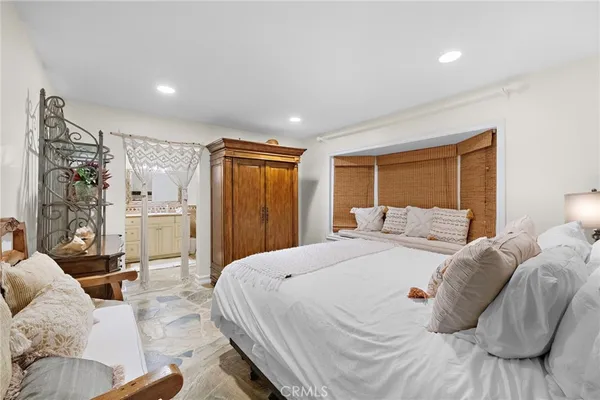 a bed room with a bed and a couch
