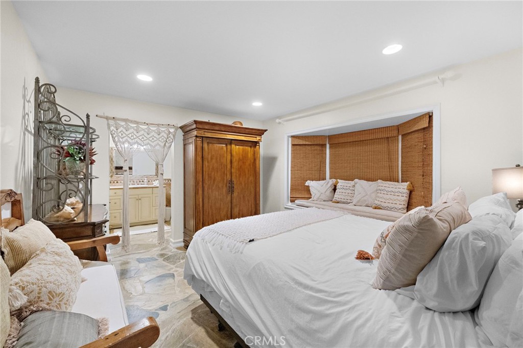 4621 Wayne Road Corona del Mar, CA 92625 - Photo 15 of 26 a bed room with a bed and a couch