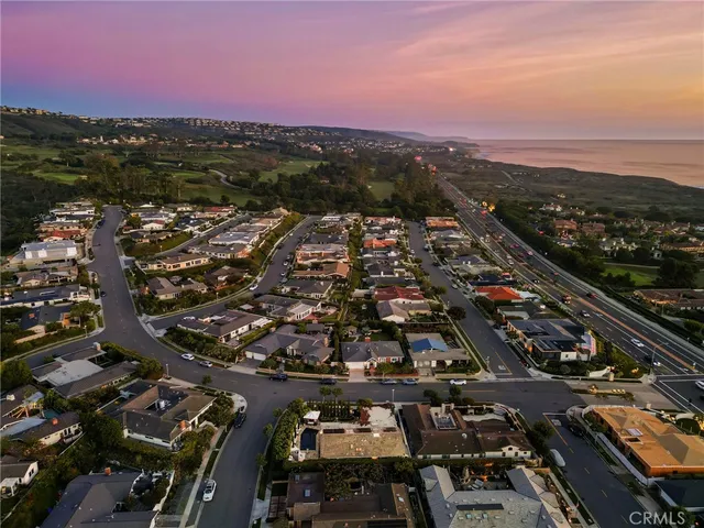 an aerial view of residential building with parking