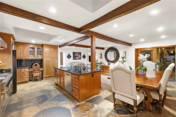a view of a kitchen and dining room