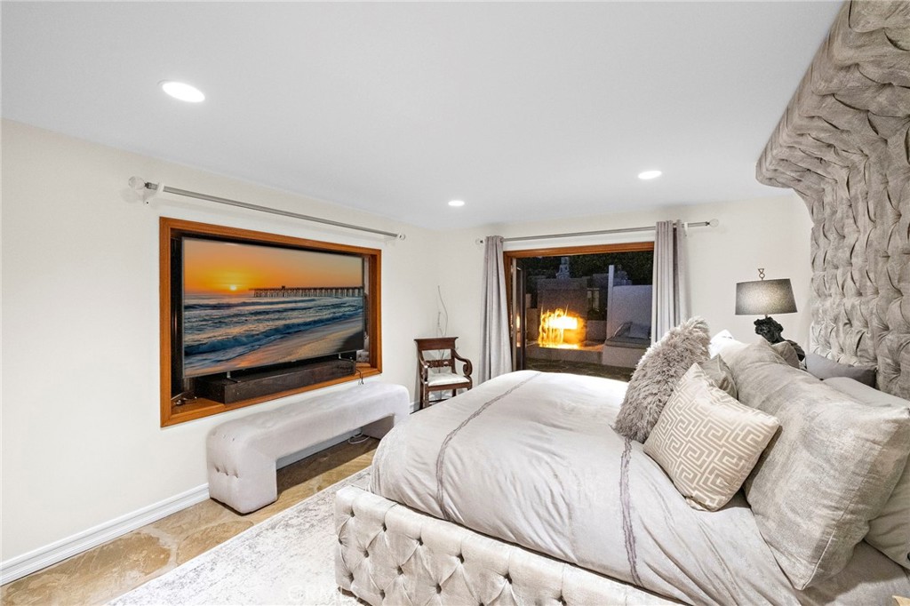 4621 Wayne Road Corona del Mar, CA 92625 - Photo 10 of 26 a bedroom with a bed and a flat screen tv