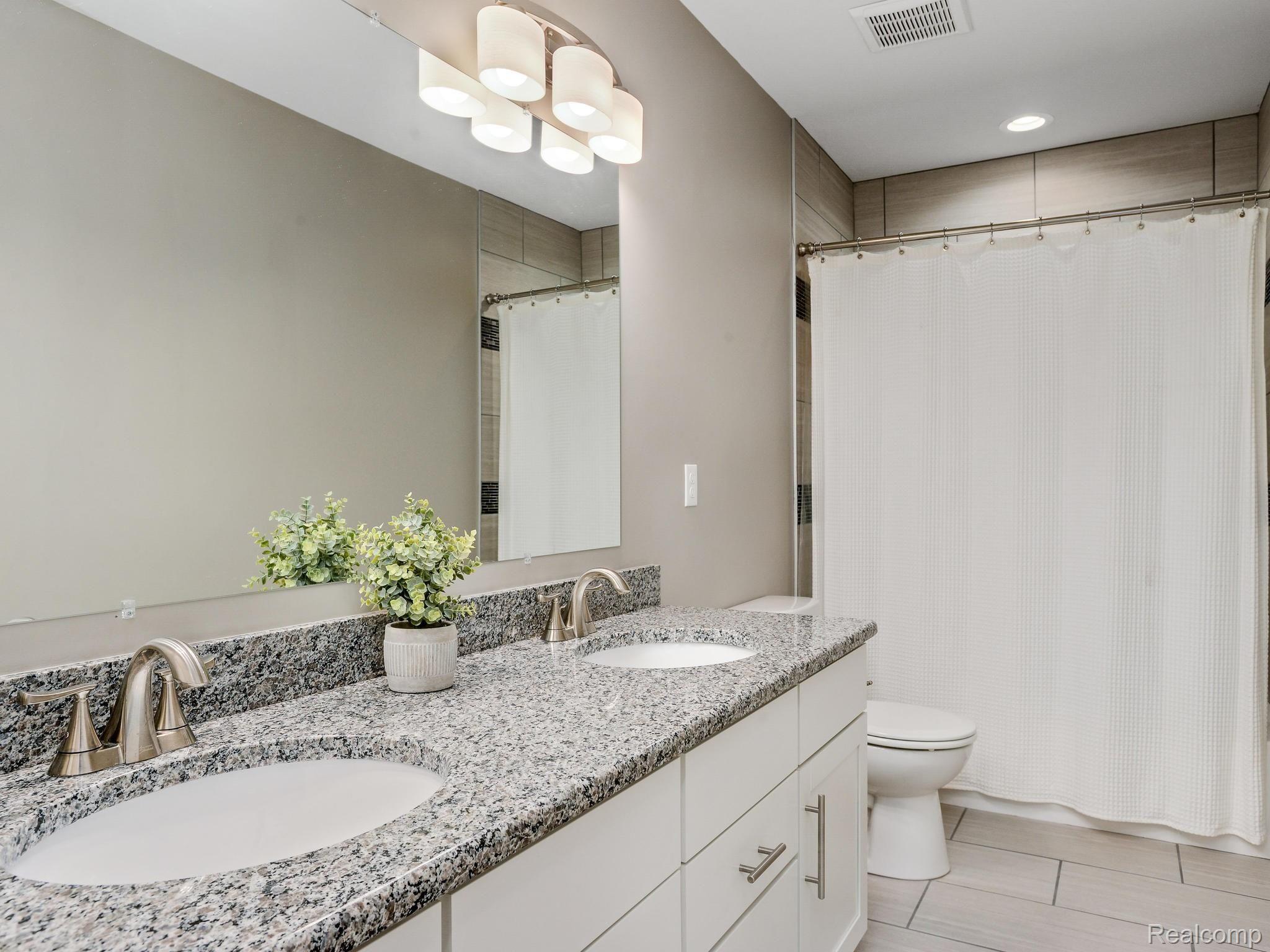 3059 Cumberland Road Berkley, MI 48072 - Photo 14 of 23 Full bath with double vanity for bedroom 2 and 3. Shower over tub.