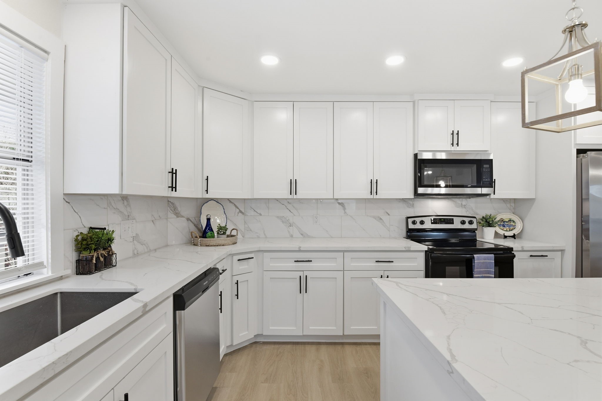 900 Cedar Road Clear Lake Shores, TX 77565 - Photo 11 of 37 Quartz countertops with large stanless steel sink