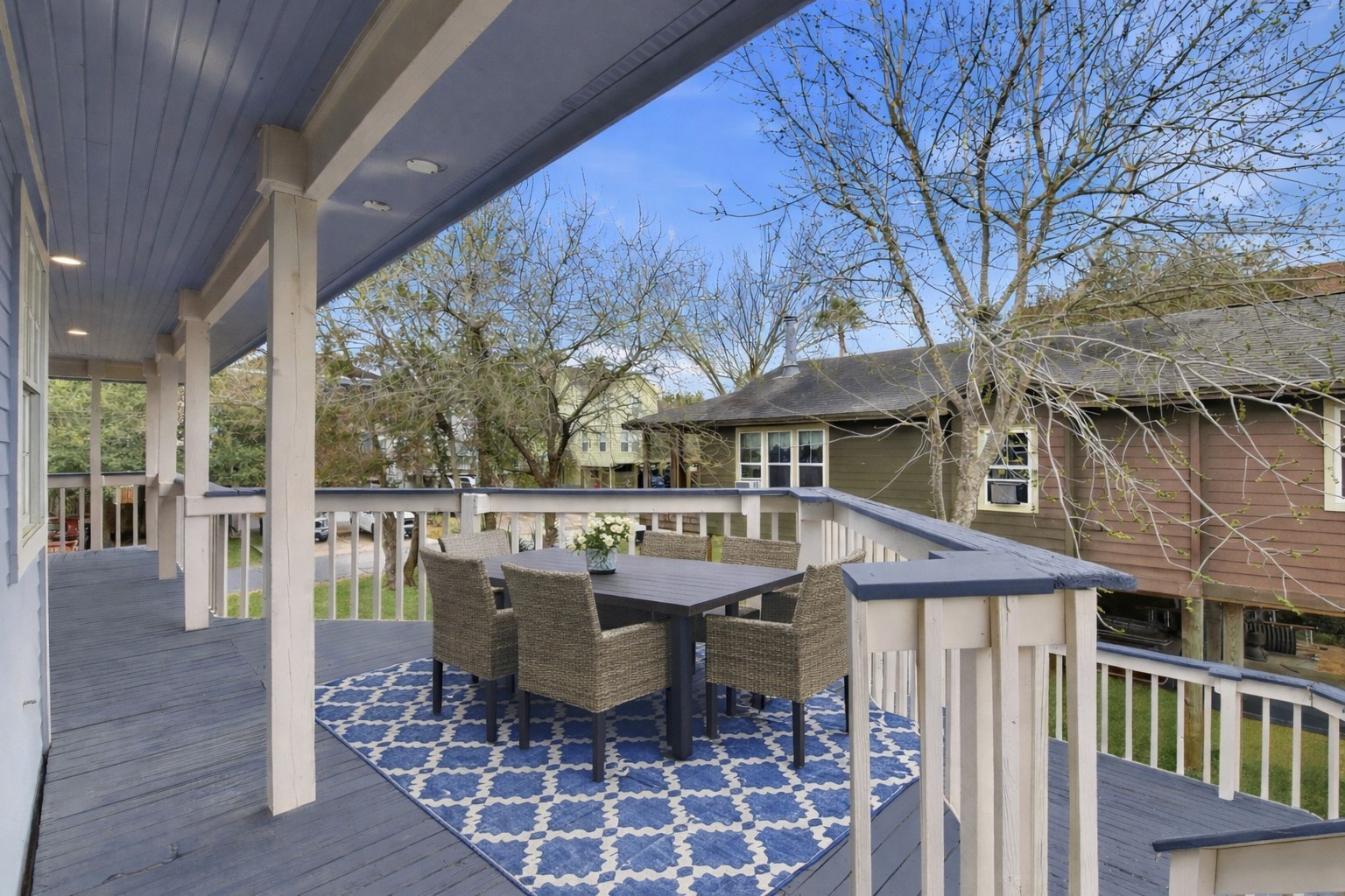 900 Cedar Road Clear Lake Shores, TX 77565 - Photo 14 of 37 The upstairs porchg extends from the kitchen, perfect for morning coffe.