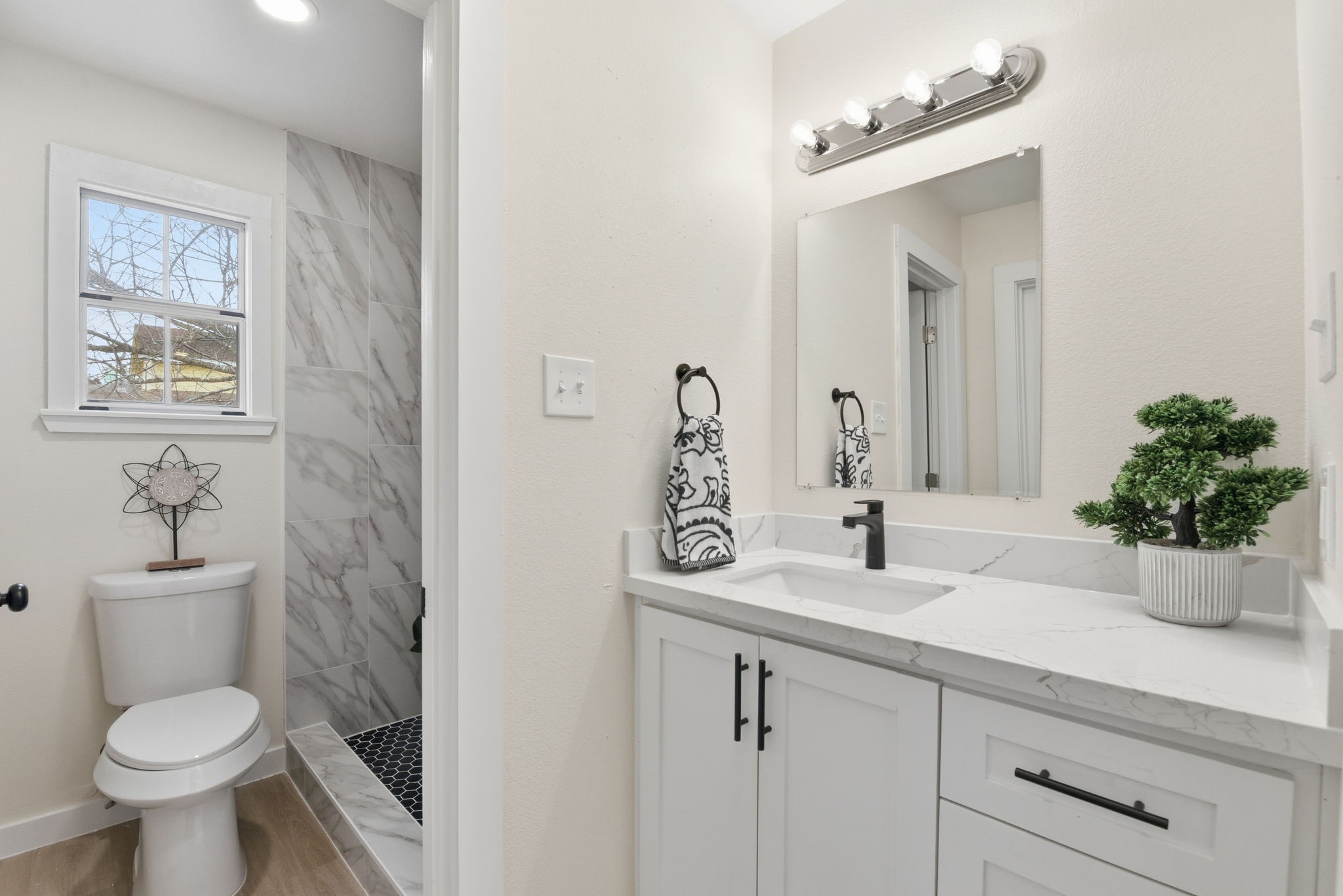 900 Cedar Road Clear Lake Shores, TX 77565 - Photo 22 of 37 Primary Bathroom with Quartz Countertops and storage.