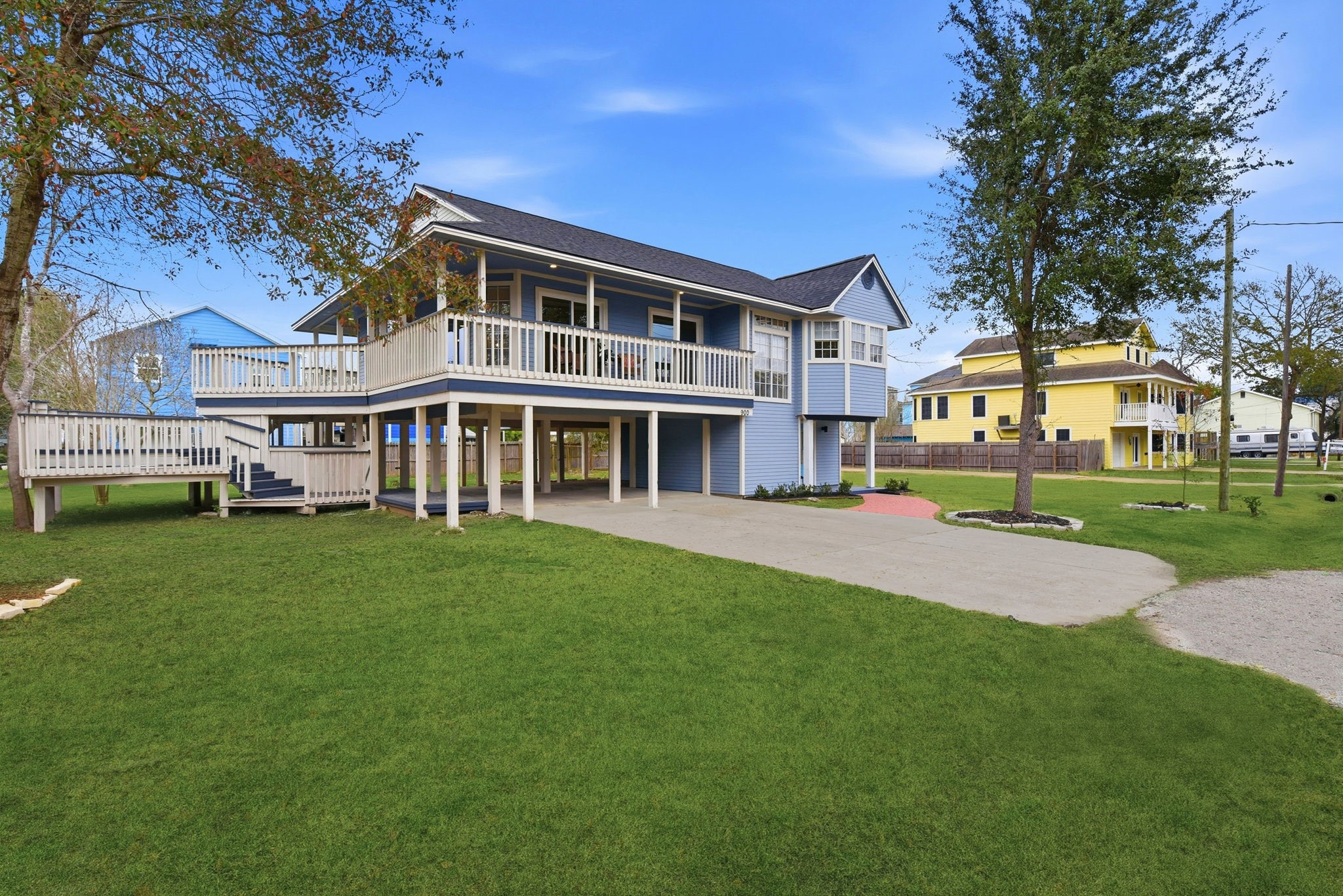 900 Cedar Road Clear Lake Shores, TX 77565 - Photo 3 of 37 The property features a generously sized yard complemented by several spacious porches, perfect for relaxing or entertaining.