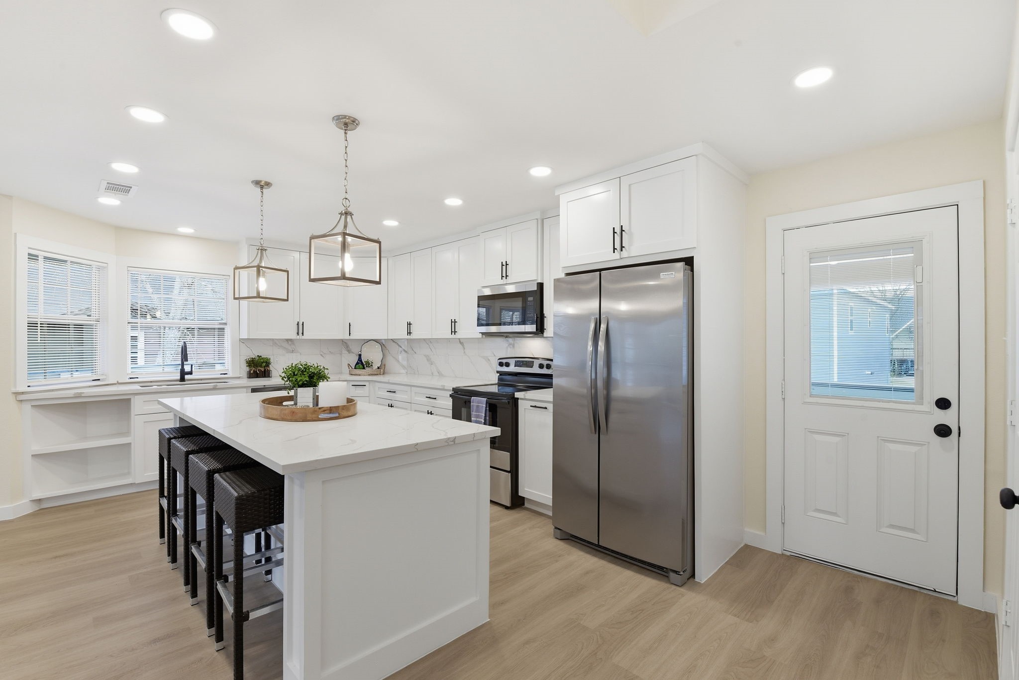 900 Cedar Road Clear Lake Shores, TX 77565 - Photo 10 of 37 New appliances include refrigerator, microwave, and Range. All convey with the home.