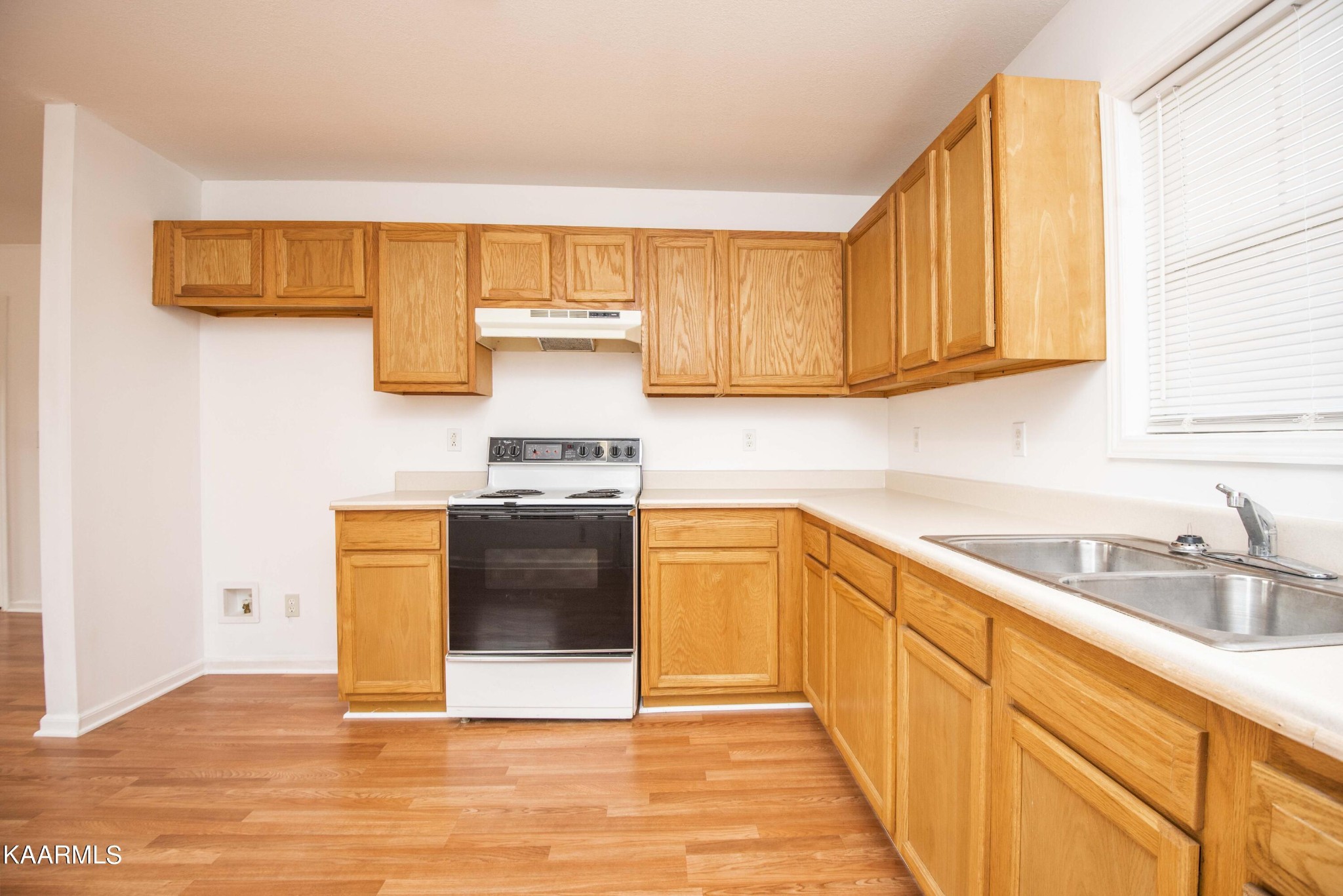 122 Donahue Road Luttrell, TN 37779 - Photo 4 of 19 a kitchen with stainless steel appliances granite countertop a sink and a stove next to a window