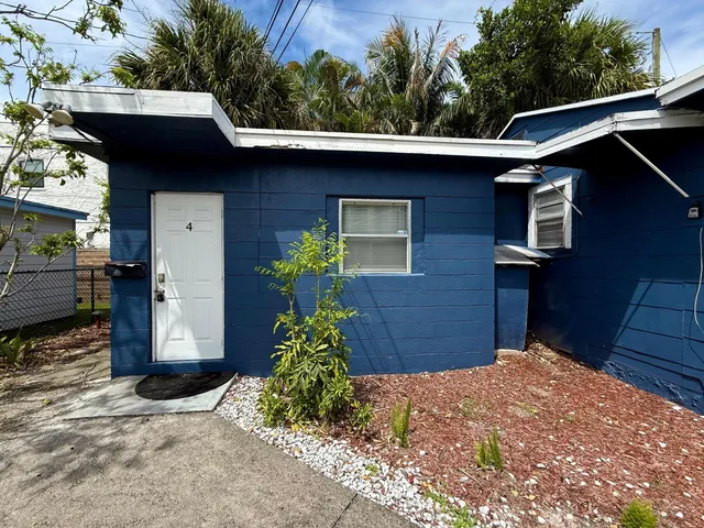 a view of a house with a small yard