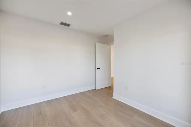 a view of a kitchen with wooden floor