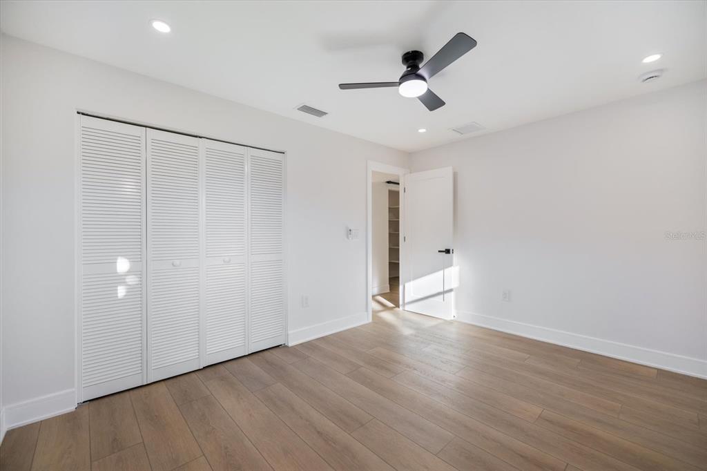 470 Leger Drive Nokomis, FL 34275 - Photo 25 of 51 wooden floor in an empty room with a window